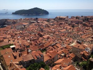 The rooftops of old Dubrovnik as seen from the 2-kilometer-long walkway atop its ancient walls. The island of Lokrum is in the background.
